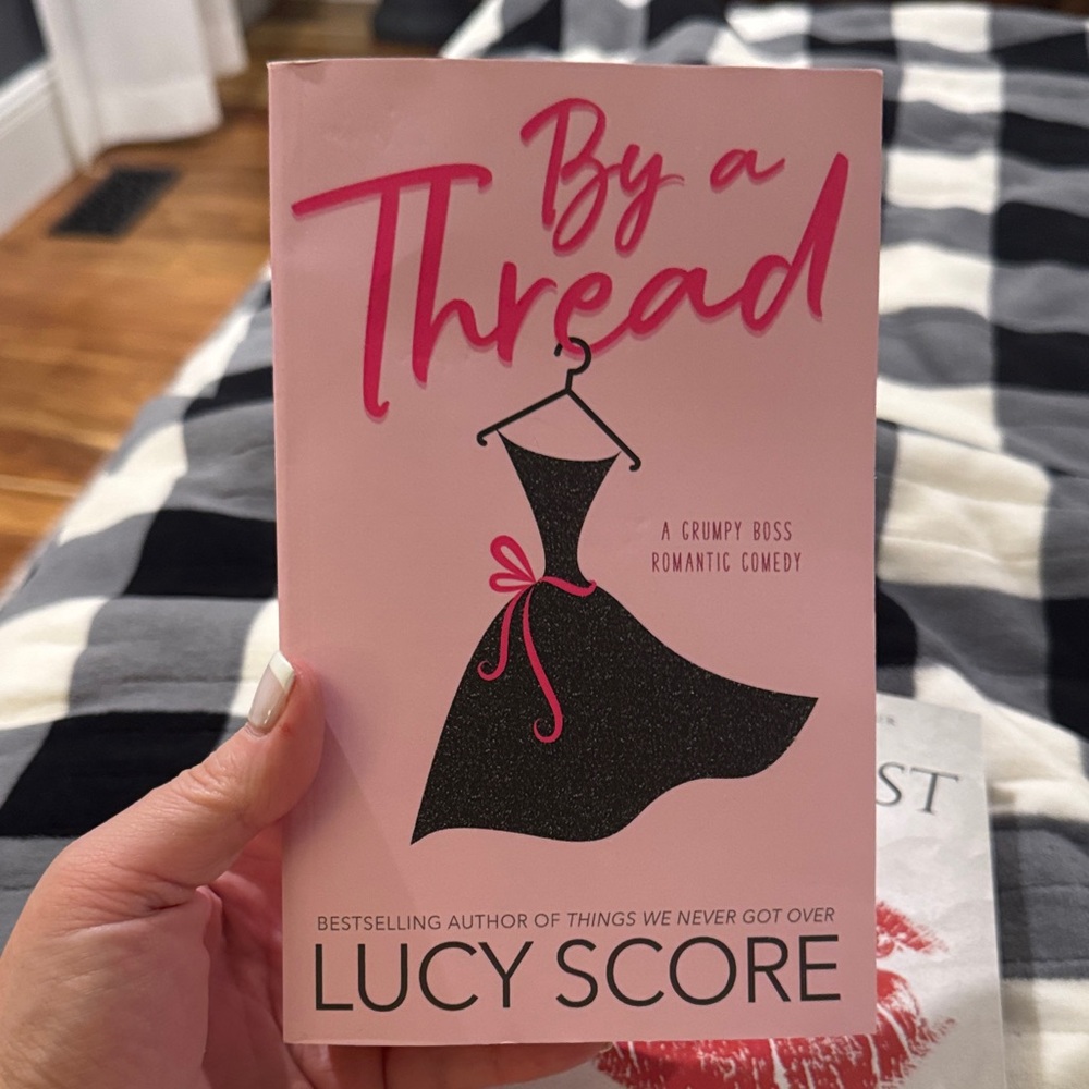 By a Thread by Lucy Score - Pink Cover Book
